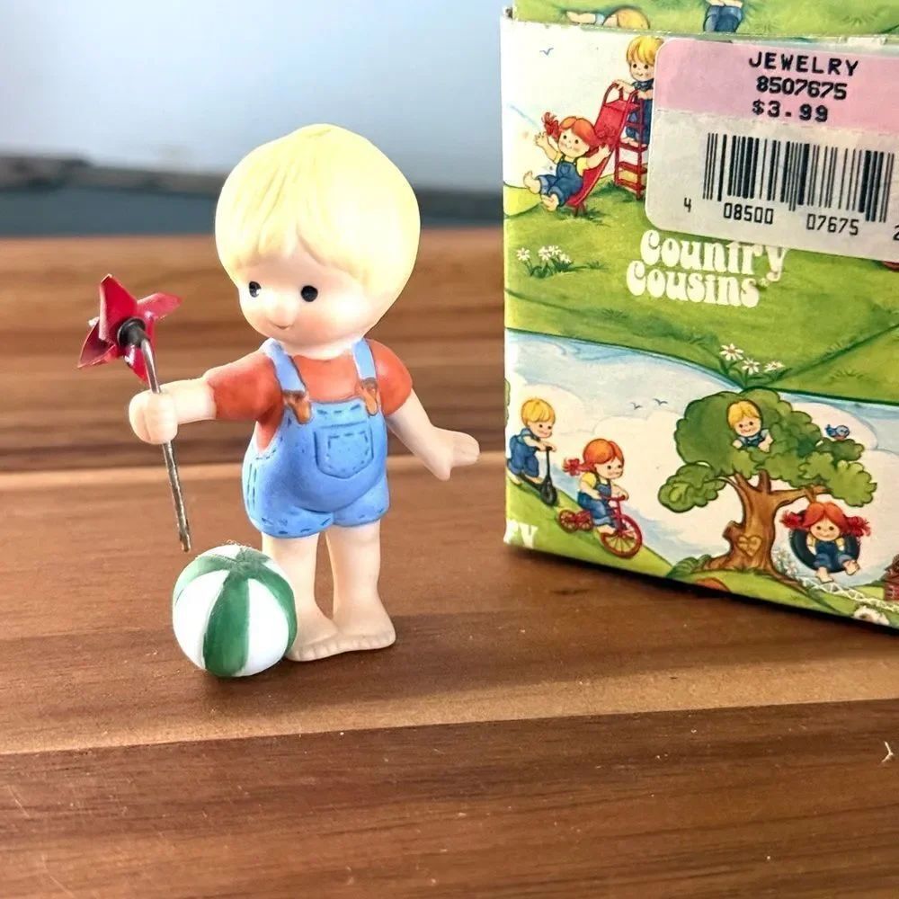 Enesco Country Cousins Skip Holding A Pinwheel